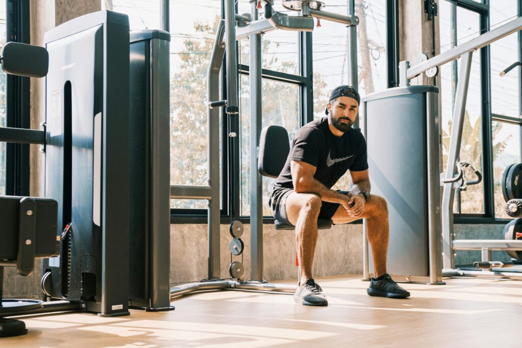 An Atom Athletics personal training client taking a rest period between sets inside a Liberty Village fitness space.